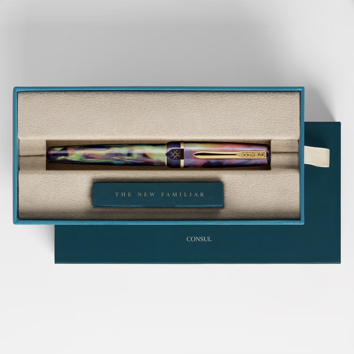 Consul Elan fountain pen in Boreal, an aurora-inspired swirl of green, teal, pink and violet resin with gold trim, capped in its teal Consul presentation box