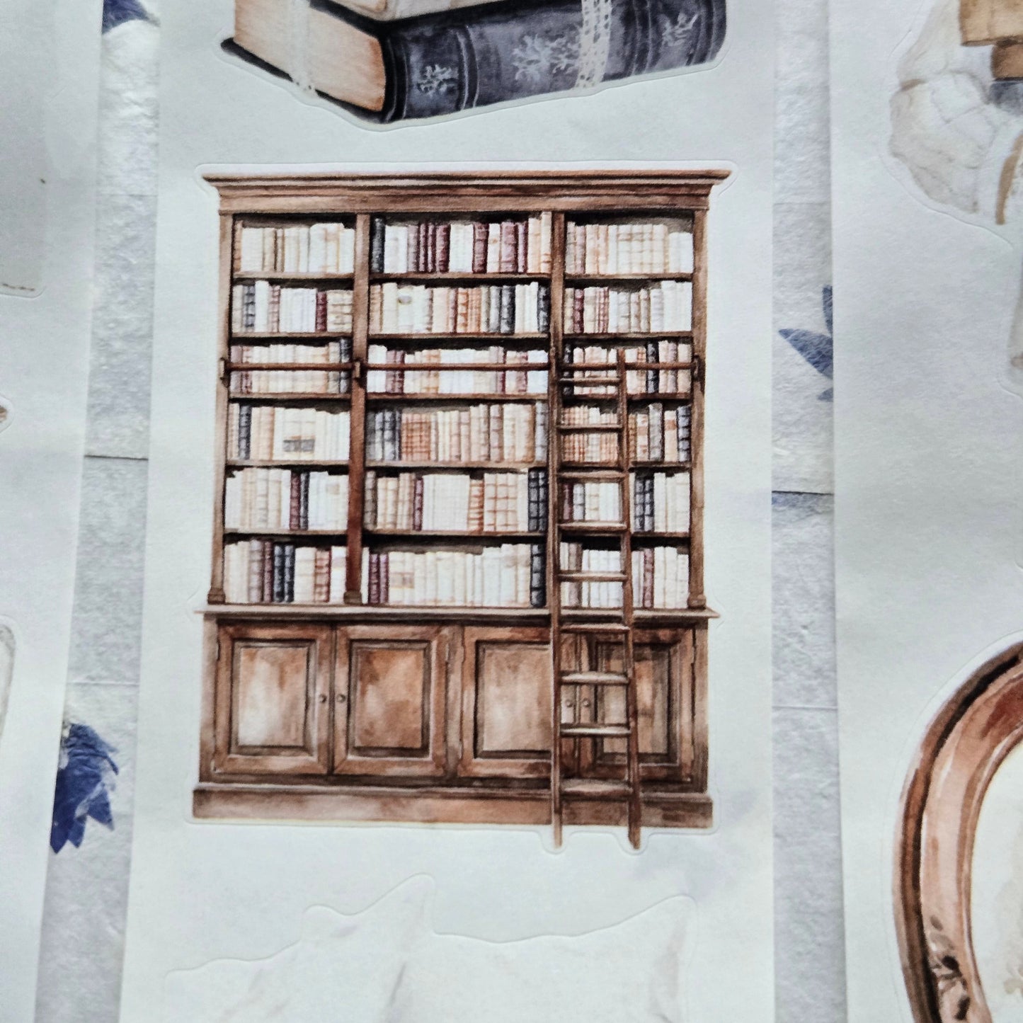 Wooden bookshelf with books on a textured surface