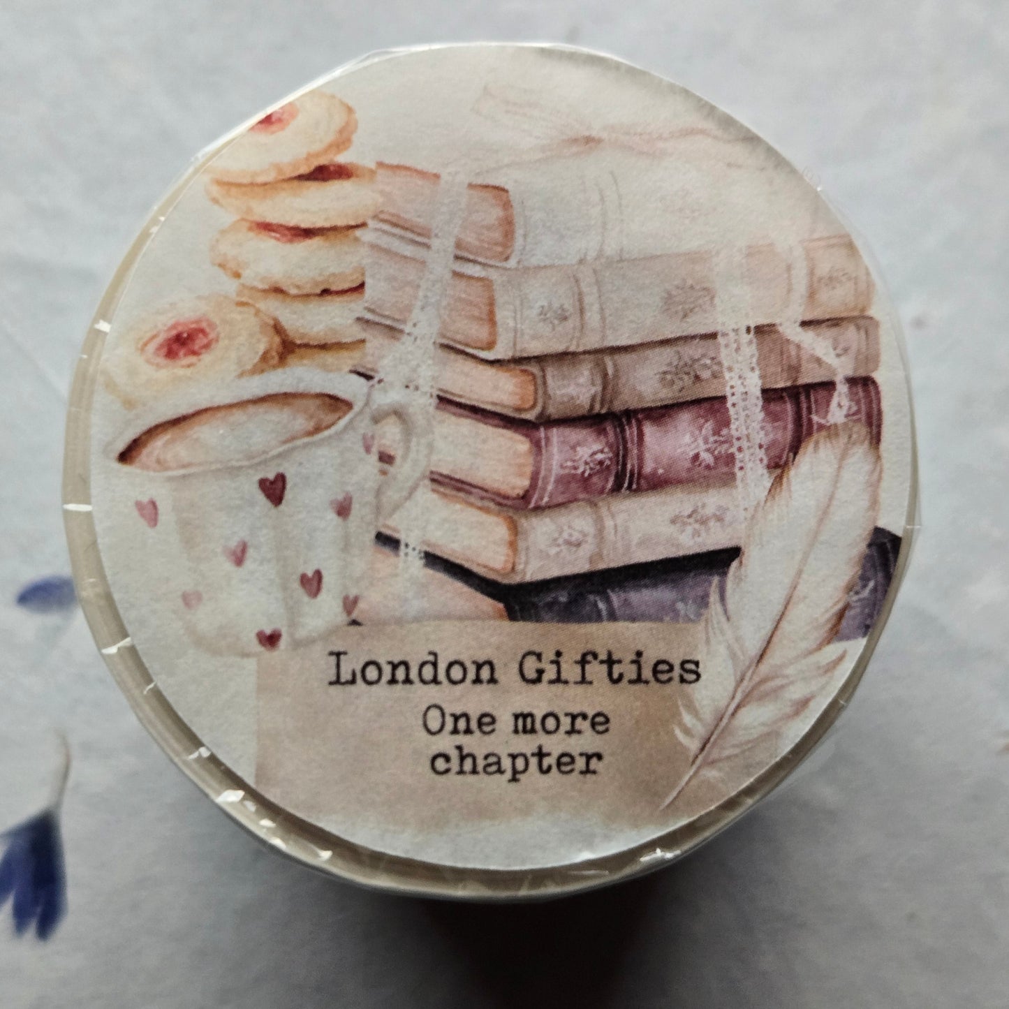 Round container with illustrations and text on a light background
