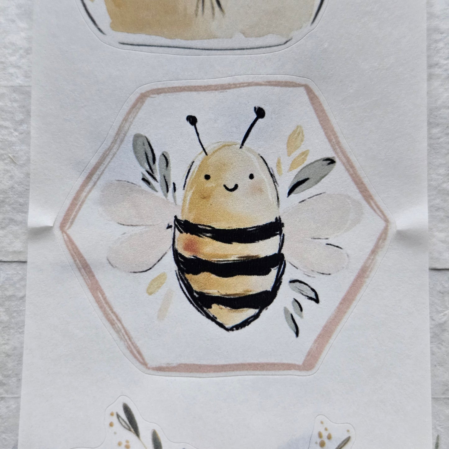 Illustration of a bee in a hexagonal frame on a textured white background