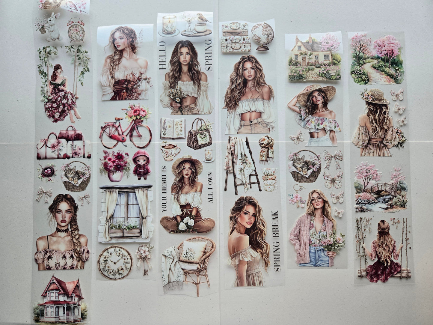 Romantic PET tape featuring springtime girls, pastel cottages, and soft florals, printed on glossy clear film for sticker‑like detail and dreamy layering.