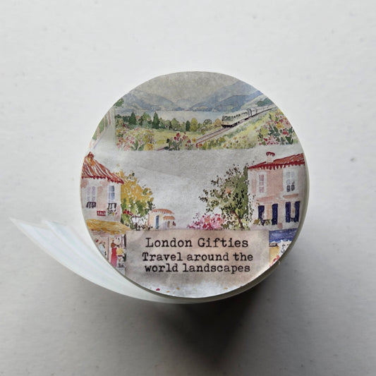 Round decorative item with scenic design and text on a light background