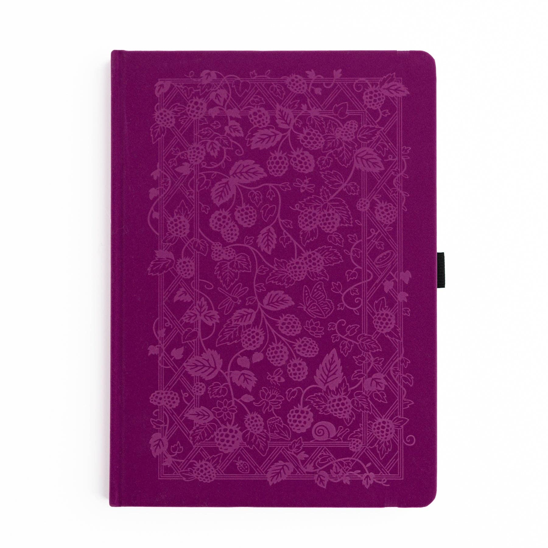 Purple notebook with intricate white floral pattern on a white background