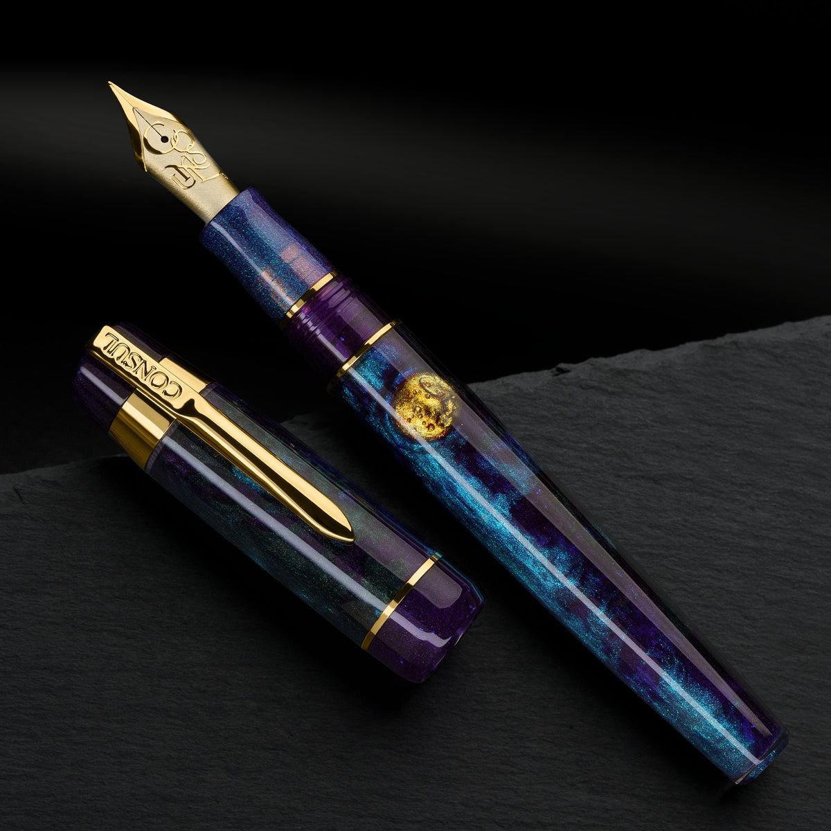 Consul Guardian Nightfall fountain pen in purple and teal resin with a hand-painted gold moon on the barrel and gold trim