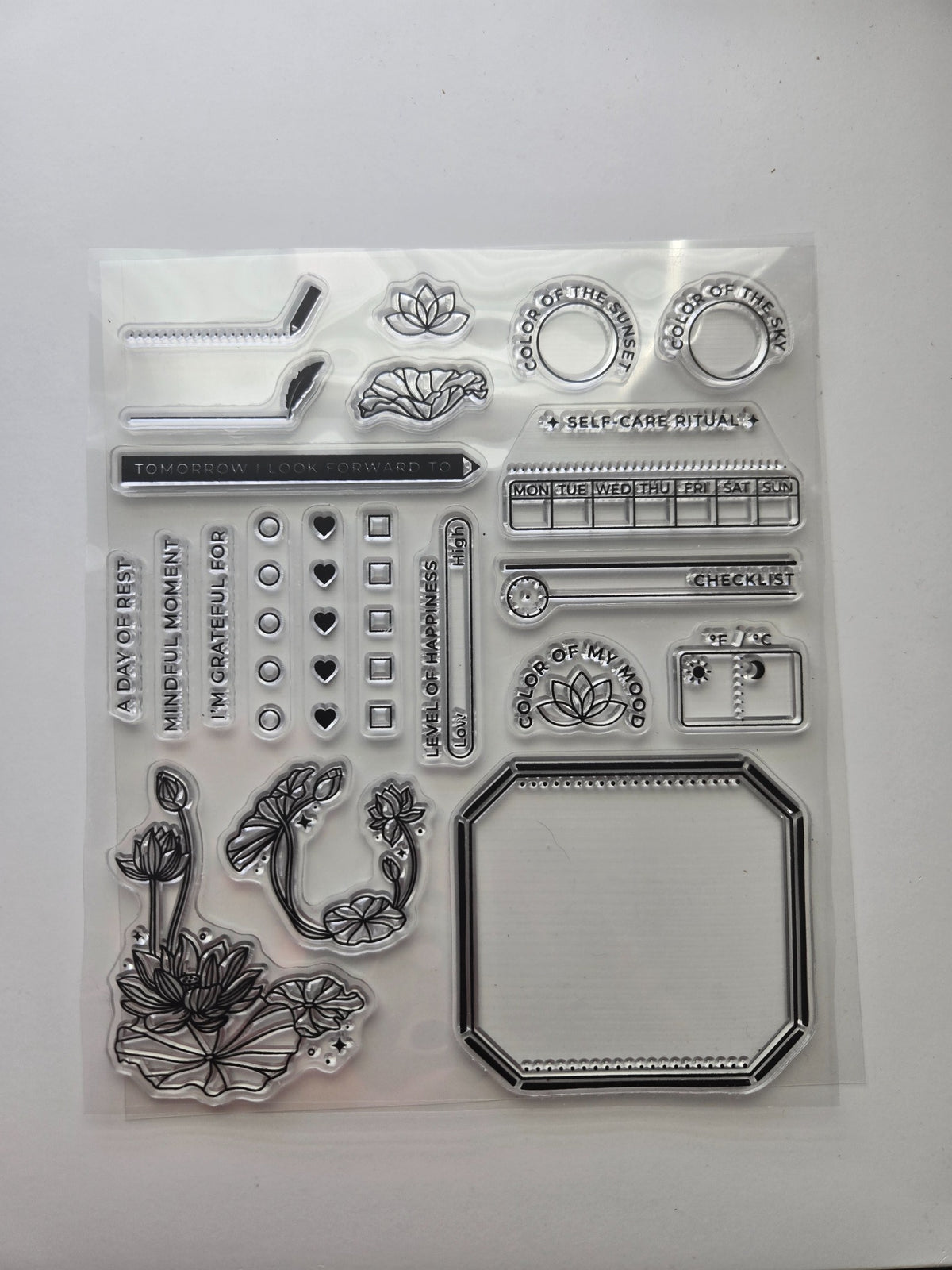 Archer & Olive Rest & Renew 2025 self-care clear stamp sheet with lotus flowers, gratitude prompts, weekly tracker, and mood stamps