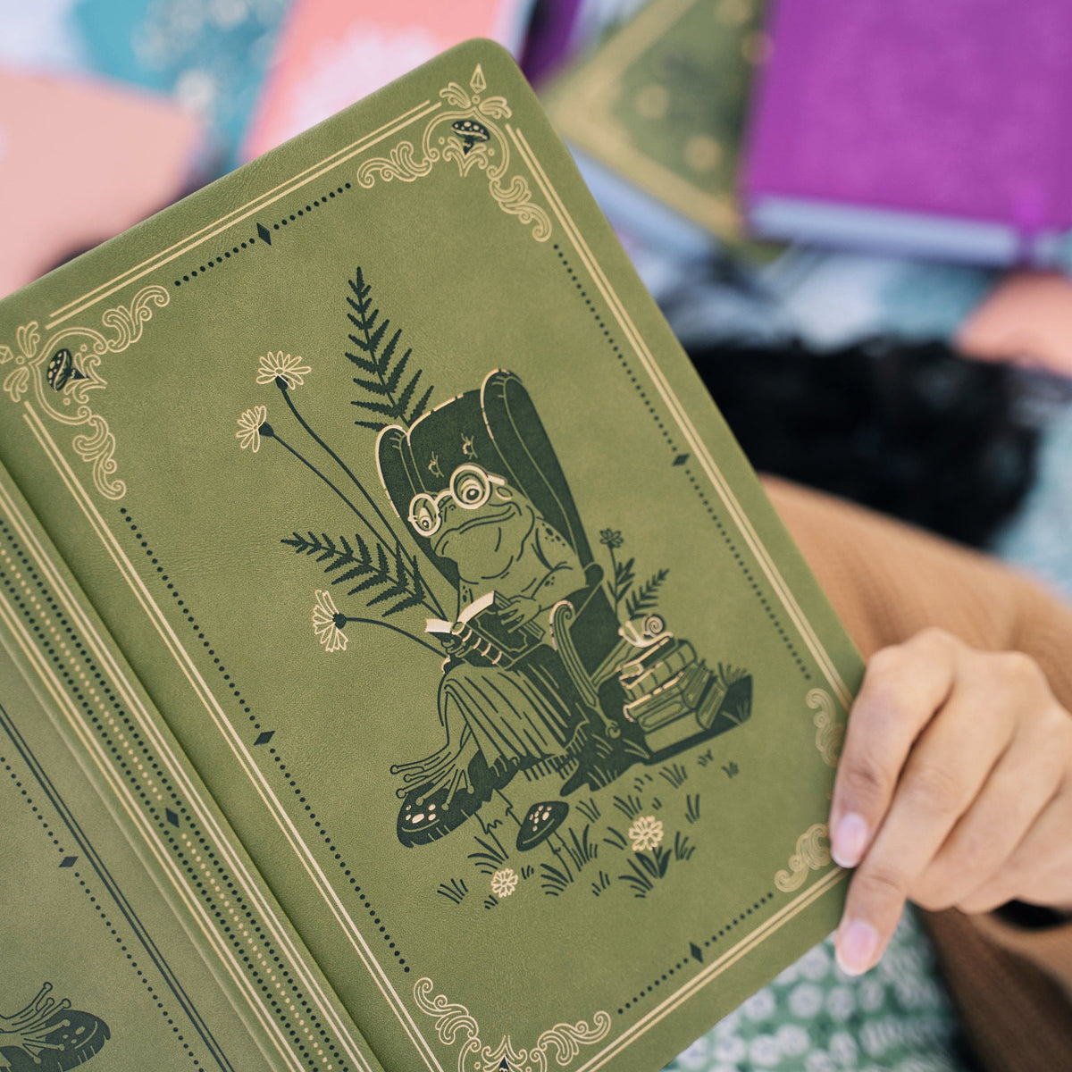 Archer & Olive Literary Frog notebook in moss green with gold foil reading frog design