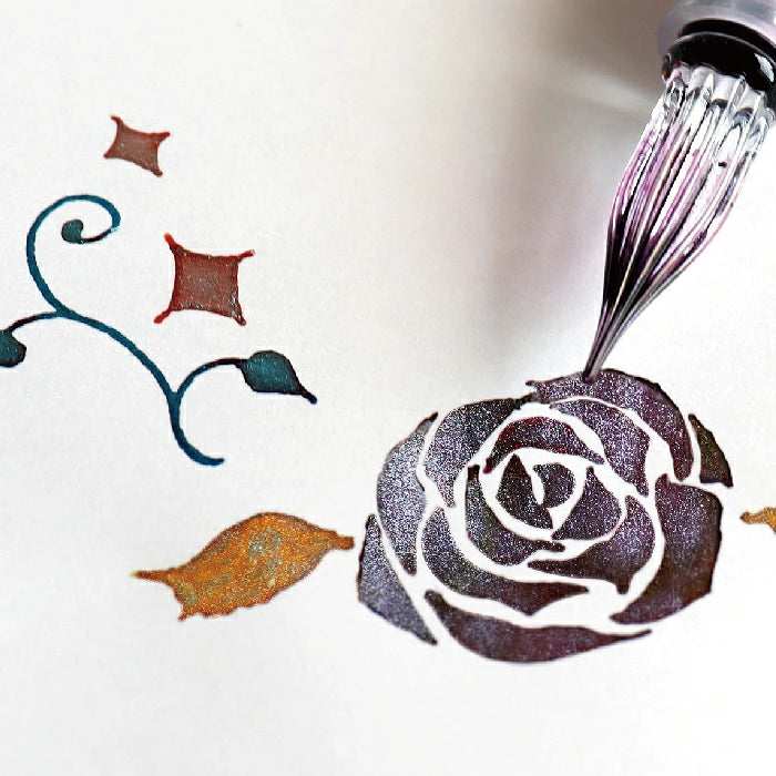 Glass dip pen drawing a shimmering rose with Teranishi Guitar Sparkle Ink