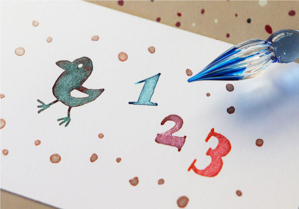 Glass dip pen lettering and drawing with colorful Teranishi Guitar Sparkle shimmer inks